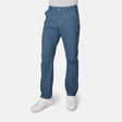 [Miguel is 6'2" wearing a size Medium.] Man wearing Free Country Men's Nylon Stretch Casual Pant in Seal, size M, made from comfortable stretch performance fabric featuring a water repellent finish, articulated knee, coin pocket, and gusset at crotch, styled with a white t shirt and white shoes #color_seal