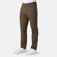 [Model is wearing a size Medium.] Man wearing Men's Nylon Stretch Convertible Pant in Saddle, size M, made from lightweight stretch performance fabric featuring a water repellent finish, an elastic waistband, above knee removable pants legs, and two side sipper pockets, styled with a grey t shirt and white shoes #color_saddle