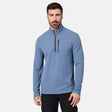 A man with dark hair and a beard wears the Men’s Altitude Quilt 1/2 Zip Mock Neck Shirt by Free Country in Ocean Heather, which features 4-way stretch and a chest pocket, standing against a plain white background.