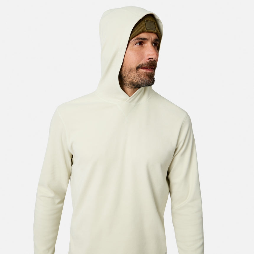 [Model is wearing size M.] A man wearing a light cream-colored long-sleeve hooded shirt, paired with a brown beanie, shown from the chest up against a solid light gray background.