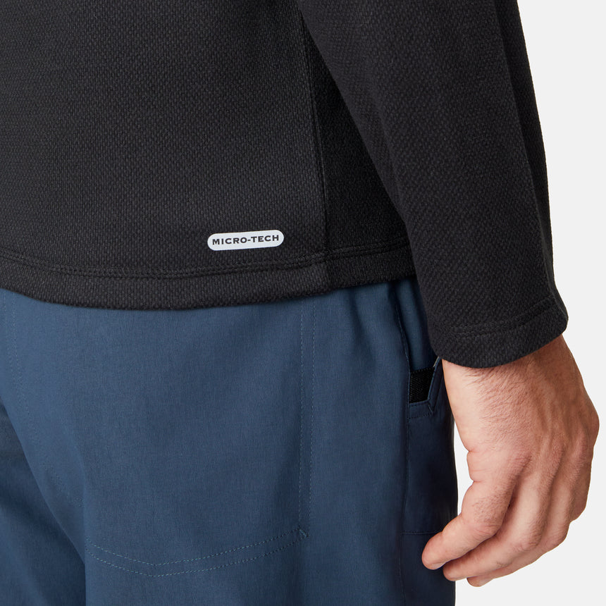 [Matt is 6'2" wearing size M.] Free Country men’s dark-colored hooded long-sleeve shirt with relaxed fit—styled with blue pants against a plain white background for a casual, comfort-forward look.