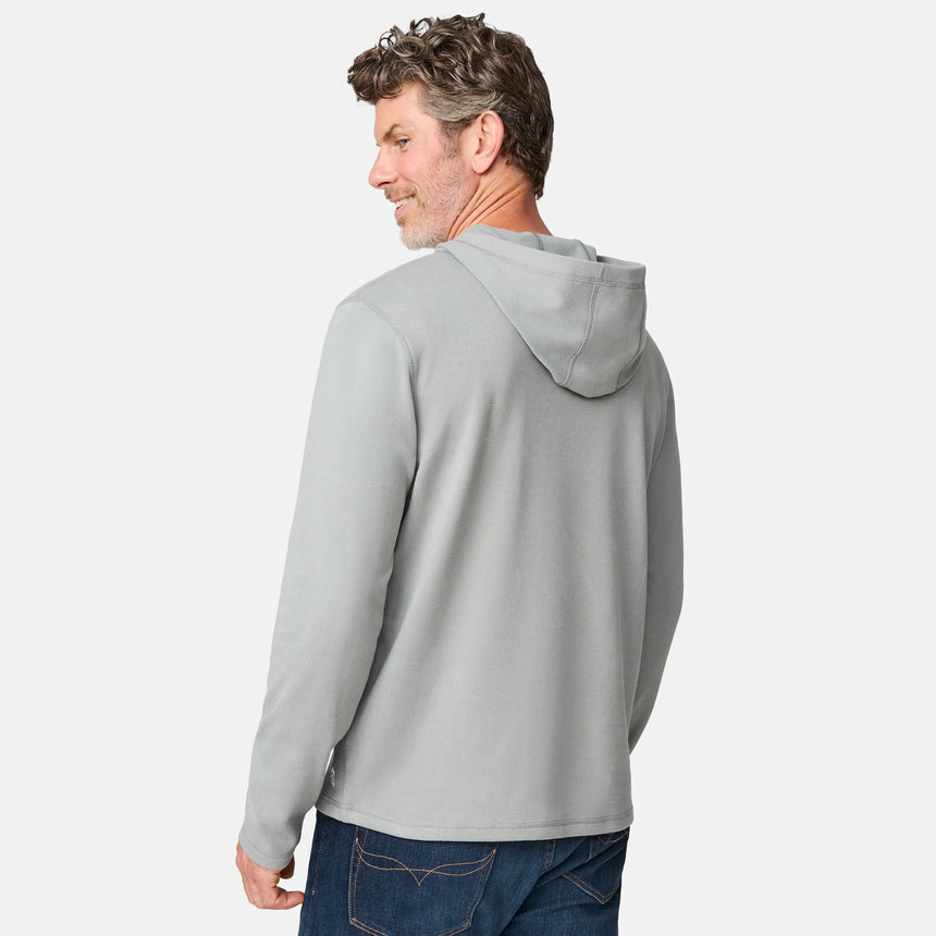 [Kolby is 6'2" wearing size M.] Free Country men’s light gray hooded long-sleeve shirt with subtle textured fabric—styled with dark blue jeans for a casual, comfort-forward look.