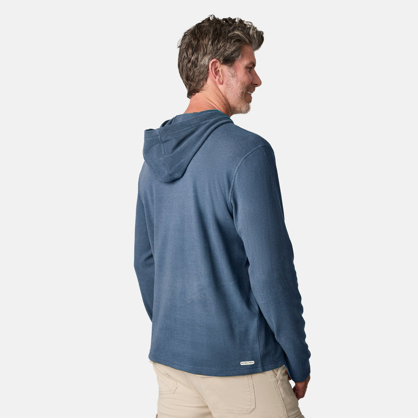 [Kolby is 6'2" wearing size M.] Free Country men’s blue textured lightweight hoodie with long sleeves and subtle pattern—paired with beige pants for a relaxed, transitional-weather look.
