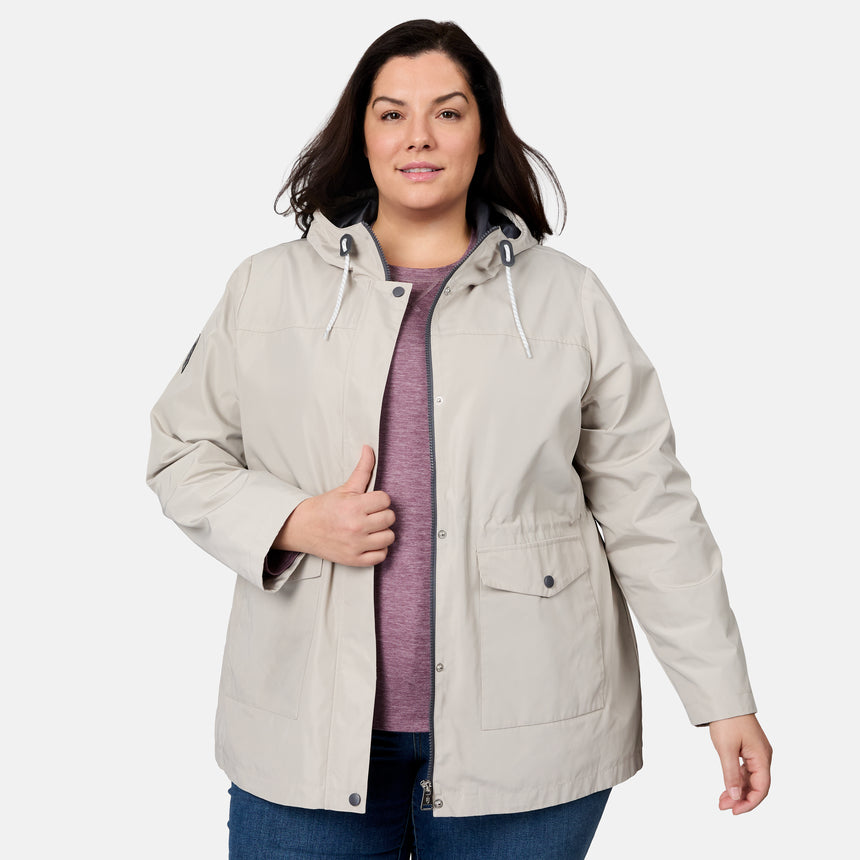 [Melissa is 5'10" wearing size 1X] Woman wearing a beige parka jacket on a white background