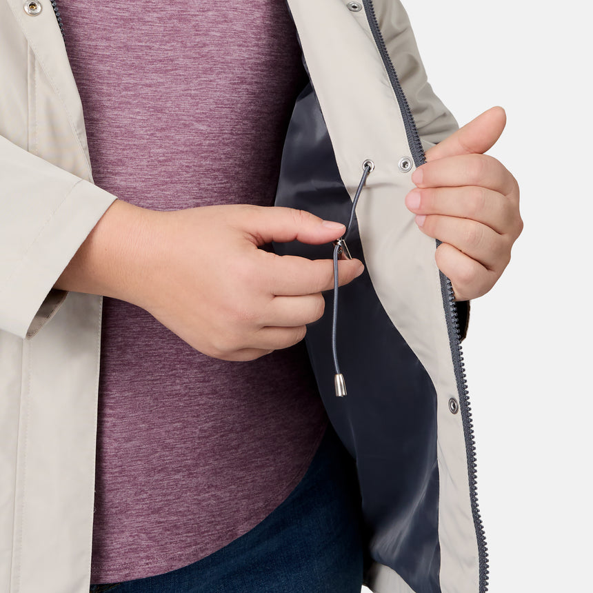[Melissa is 5'10" wearing size 1X] Person adjusting a zipper on a jacket with a white background