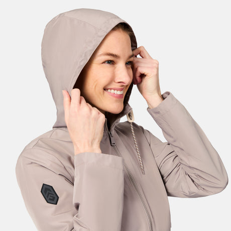 [Kaitlyn is 5'9" wearing size S] Woman wearing a beige hooded jacket on a light gray background