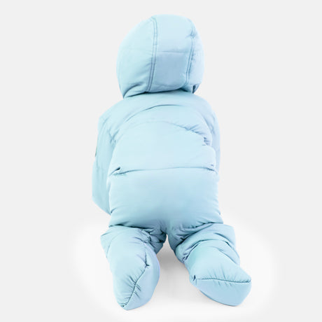 A baby in the Clearance Kids' Out of Bound Puffer Snow Suit, featuring a light blue color, sherpa lining, hood, and double zipper opening, is seen crawling from behind on a white background.