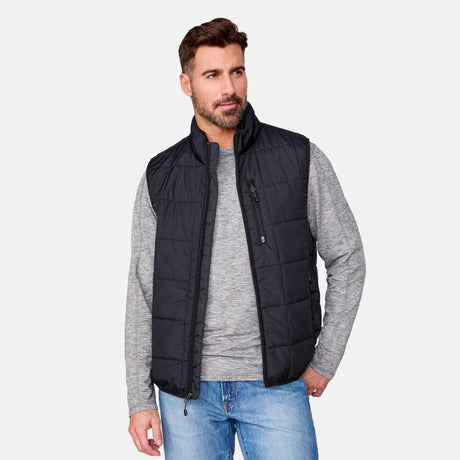 [Justin is 6'1" wearing size M.] Men’s Free Country black quilted vest with zip-front closure and stand collar—layered over a gray long-sleeve shirt and blue jeans. Designed for lightweight warmth and styled for transitional weather versatility.