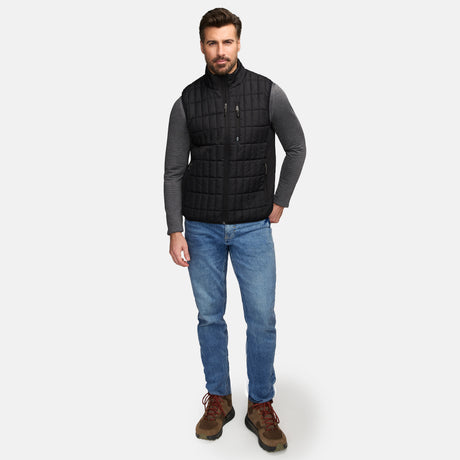 Front view of man in black quilted Sperrin vest with zip pockets and stand collar