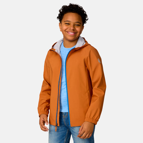 [Model is wearing a size Medium.] Boy wearing the Free Country Boys' Hydro Lite Recess X2O Rain Jacket in Autumn, size M, featuring lightweight wind resistant and waterproof fabric and an attached hood, paired with blue jeans #color_ autumn