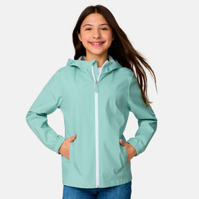 [Model is wearing a size Medium.] Girl wearing the Free Country Girls' Recess X2O Rain Jacket in Green Tea, size M, featuring lightweight stretch weatherproof fabric and a full length zipper and attached hood, paired with blue jeans #color_ green-tea