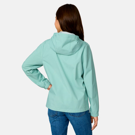 [Model is wearing a size Medium.] Girl wearing the Free Country Girls' Recess X2O Rain Jacket in Green Tea, size M, featuring lightweight stretch weatherproof fabric and a full length zipper and attached hood, paired with blue jeans #color_ green-tea