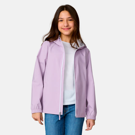 [Model is wearing a size Medium.] Girl wearing the Free Country Girls' Recess X2O Rain Jacket in Wisteria, size M, featuring lightweight stretch weatherproof fabric and a full length zipper and attached hood, paired with blue jeans #color_ wisteria