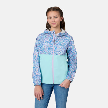 [Kai is wearing size 10-12 M] Child wearing a floral-patterned jacket with a light blue bottom half on a white background