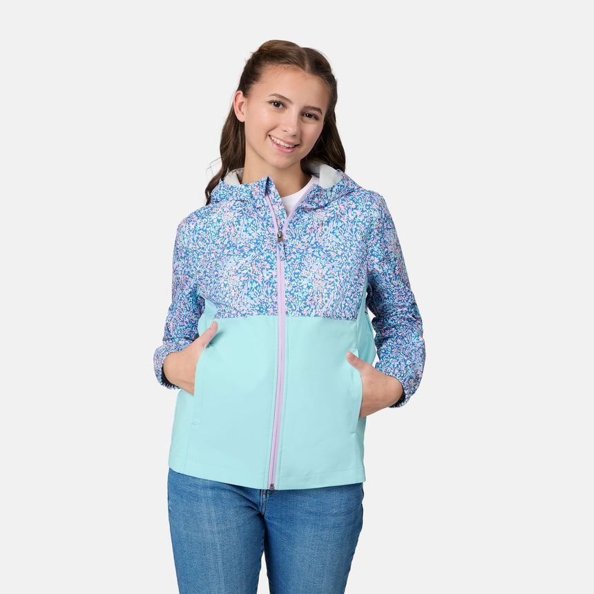 [Kai is wearing size 10-12 M] Child wearing a floral-patterned jacket with a light blue bottom half on a white background