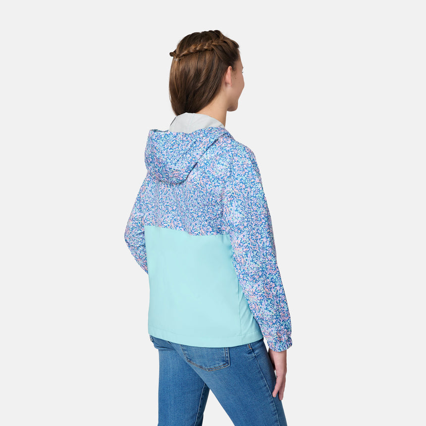 [Kai is wearing size 10-12 M] Child wearing a floral-patterned jacket with a light blue bottom half on a white background