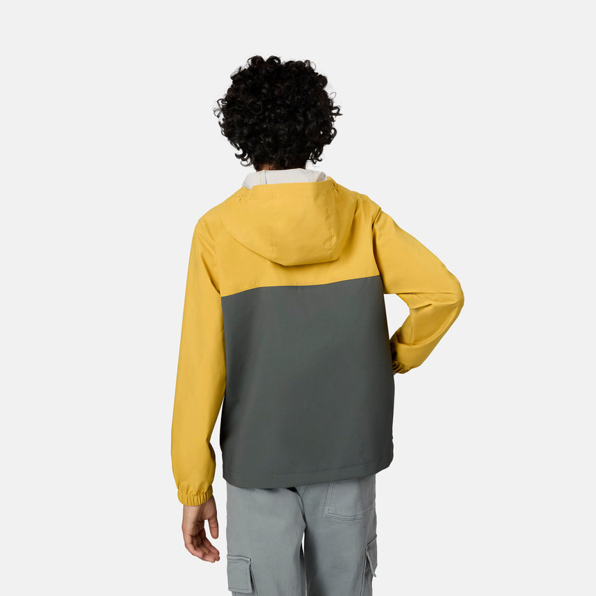 [Emporer is wearing size 10/12] Child wearing a two-tone yellow and gray jacket on a white background