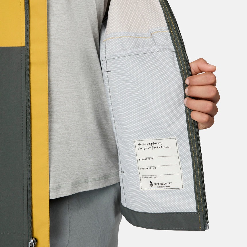 [Emporer is wearing size 10/12] Child wearing a two-tone yellow and gray jacket on a white background