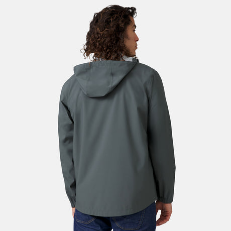 [Jordan is 6'2" wearing a size Medium.] Man wearing Free Country Men's Hydro Lite X2O Spectator Waterproof Jacket in Pewter, size M, made from lightweight four way stretch performance fabric featuring sealed seams, elastic cuffs, and an attached hood with a drawcord, styled with blue jeans #color_pewter