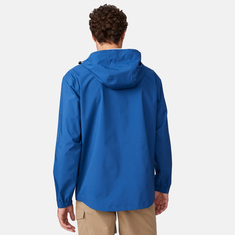 [Miguel is 6'2" wearing a size Medium.] Man wearing Free Country Men's Hydro Lite X2O Spectator Waterproof Jacket in Denim, size M, made from lightweight four way stretch performance fabric featuring sealed seams, elastic cuffs, and an attached hood with a drawcord, styled with khaki pants #color_denim
