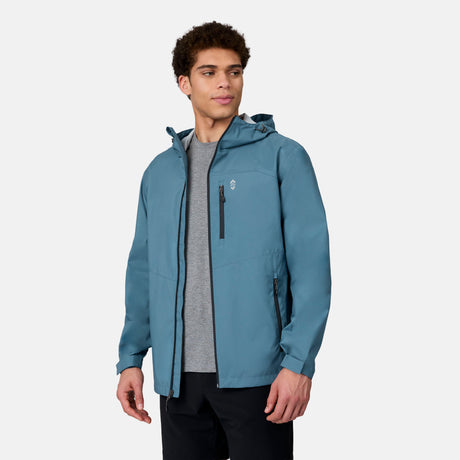 [Ikce is 6’1" wearing size M] Man wearing a blue rain jacket on a white background