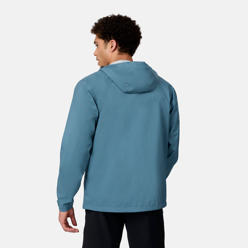 [Ikce is 6’1" wearing size M] Back view of man wearing a blue rain jacket on a white background
