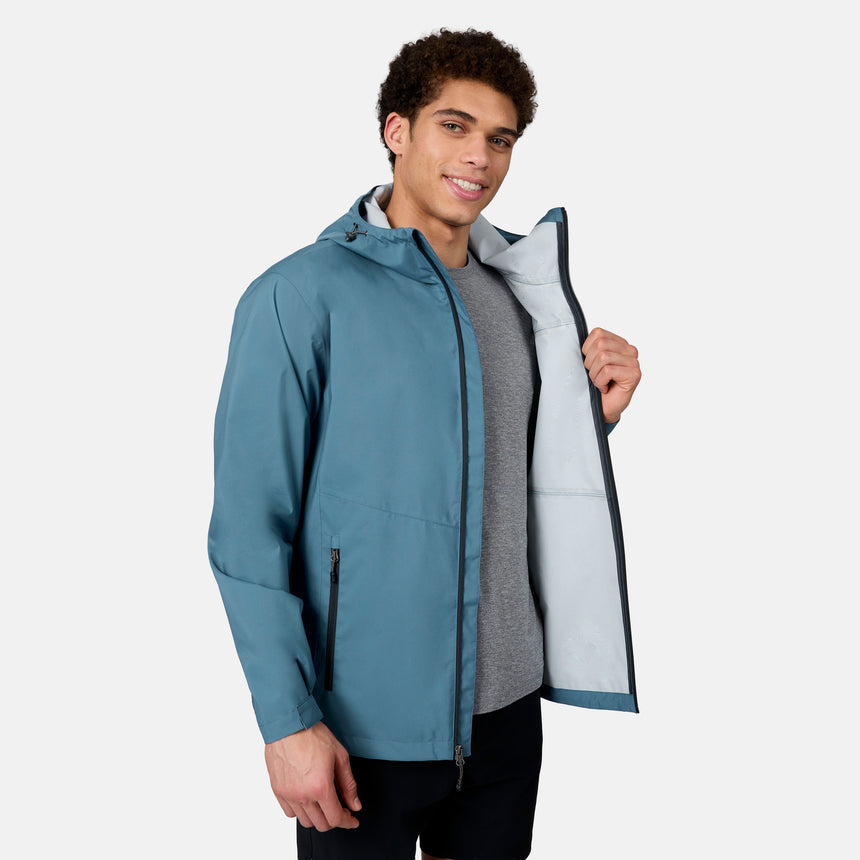 [Ikce is 6’1" wearing size M] Man wearing a blue jacket with a gray interior, standing against a white background