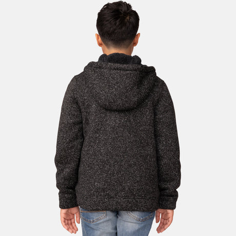 [Model is wearing a size Medium.] Boy wearing the Free Country Boys' Mountain Fleece Hoodie Jacket in black heather, featuring a light grey zipper and small round logo on the sleeve.
