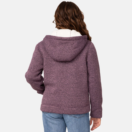 [Model is wearing size M.] Girl wearing the Free Country Girls' Mountain Fleece Jacket in textured purple, layered over a white shirt and blue jeans, smiling in a neutral-colored indoor setting.