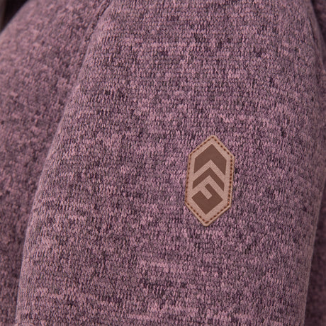 [Model is wearing size M.] Girl wearing the Free Country Girls' Mountain Fleece Jacket in textured purple, layered over a white shirt and blue jeans, smiling in a neutral-colored indoor setting.