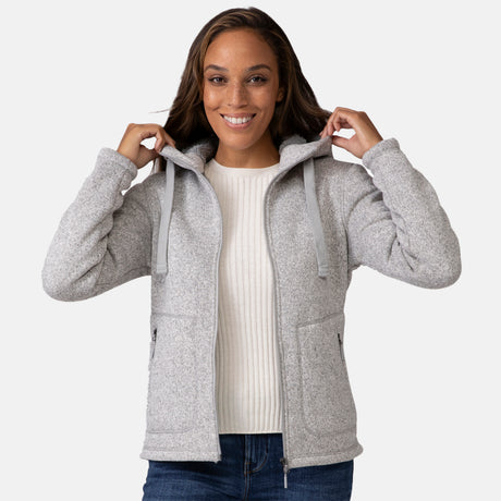 [Shelby is 5'9" wearing a size Small.] Woman wearing Free Country Women's Mountain Fleece Jacket in grey with a full front zipper opening, soft lining, lower pockets, an attached hood with an adjustable drawcord, light grey background. Best women’s jacket for fall weather.