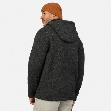 A person seen from behind, wearing a charcoal-flecked Free Country Men’s Mountain Fleece Jacket and an orange knit cap.