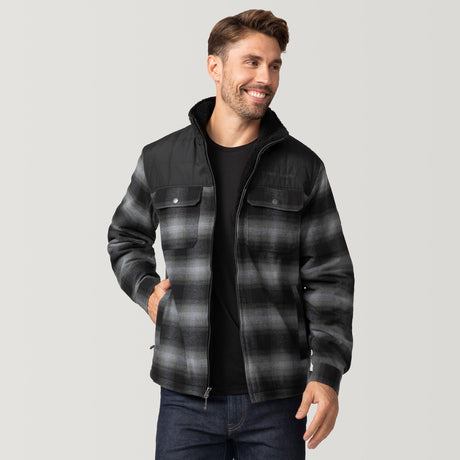 [Matt is 6'2" wearing a size Medium.] Man wearing Free Country Men's Woodsman Work Jacket in grey and black plaid with a full front zipper opening, soft lining, and recycled polyester filling, light grey background. Perfect men’s jacket for fall weather.