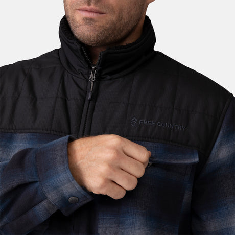 [Vince is 6'1" wearing a size Medium.] Man wearing Free Country Men's Woodsman Work Jacket in blue and black plaid with a full front zipper opening, soft lining, and recycled polyester filling, light grey background. Perfect men’s jacket for fall weather.