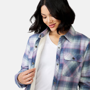 [Megan is 5’6” wearing a size Small.] Woman wearing Free Country Women's Koshi Adirondack Flannel Shirt Jacket in pink and blue and white plaid with a full front button opening, soft lining, chest pockets, light grey background. Best women’s jacket for winter weather.
