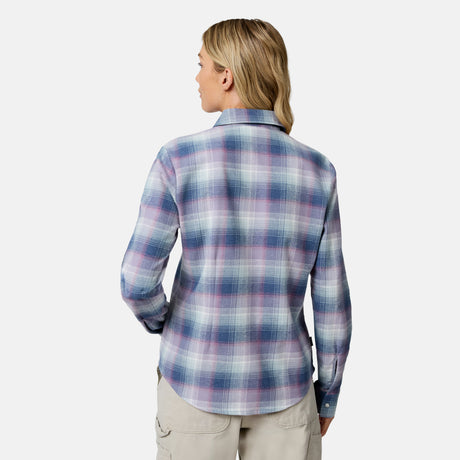 [Model is wearing size S.] A woman shown from the back wearing a long-sleeve plaid button-up shirt in shades of blue, purple, and white, paired with khaki pants, against a light gray studio background.