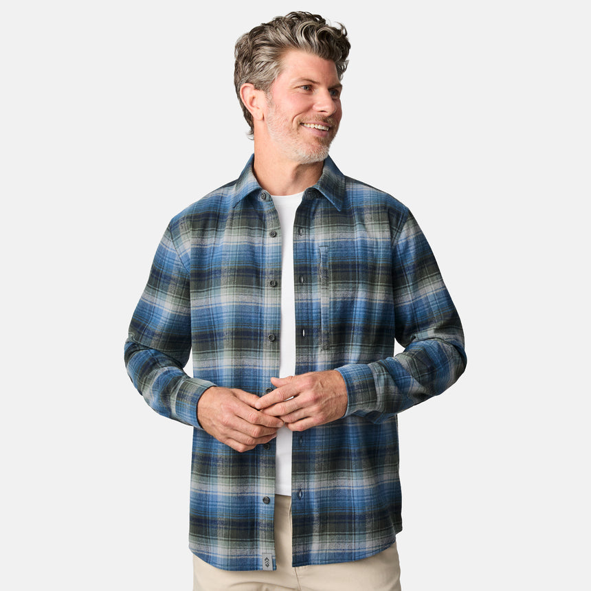 [Kolby is 6'2" wearing size M.] Men’s long-sleeve plaid button-up shirt in blue, black, and white — soft flannel texture with checkered design and casual fit