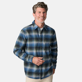 [Kolby is 6'2" wearing size M.] Men’s long-sleeve plaid button-up shirt in blue, black, and white — soft flannel texture with checkered design and casual fit