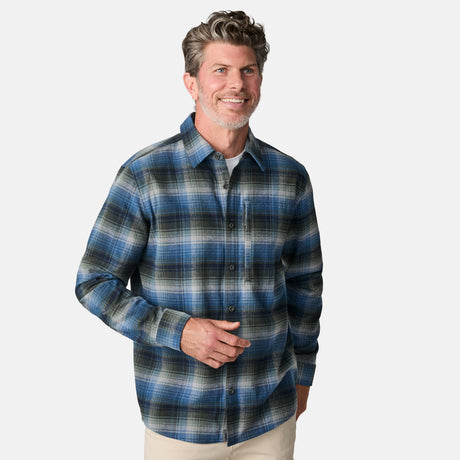[Kolby is 6'2" wearing size M.] Men’s long-sleeve plaid button-up shirt in blue, black, and white — soft flannel texture with checkered design and casual fit