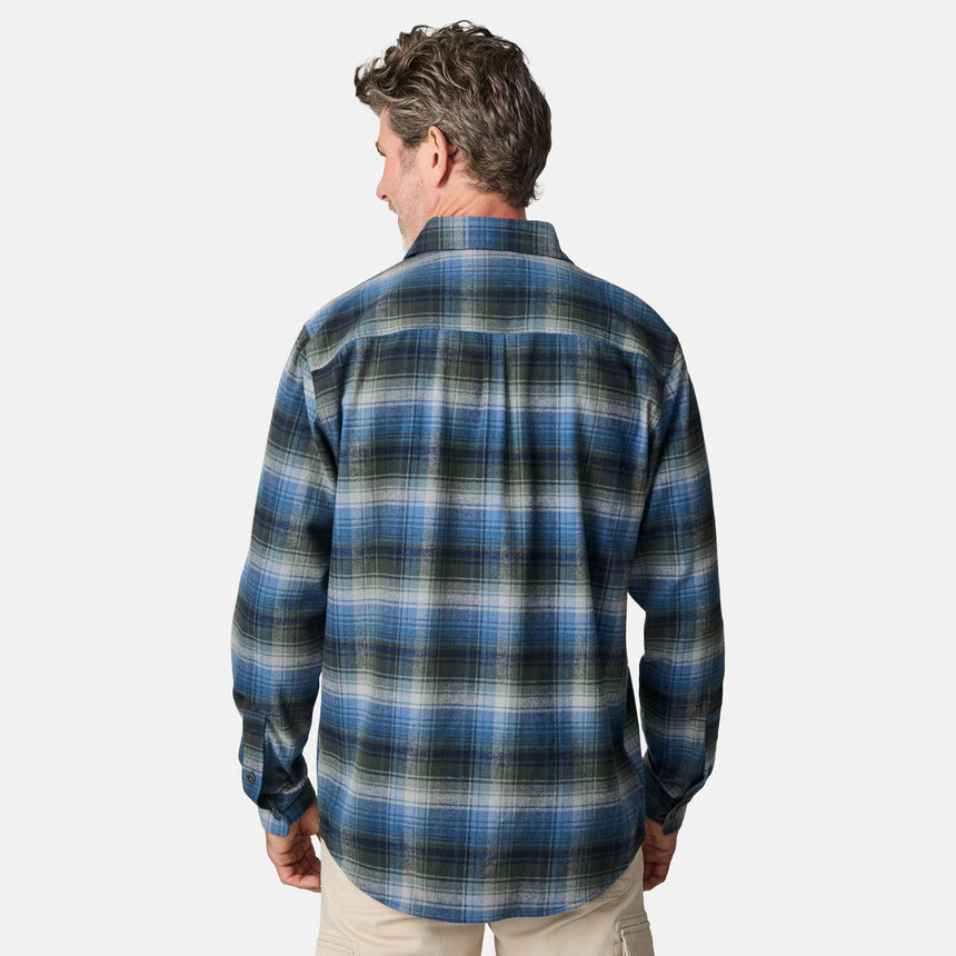 [Kolby is 6'2" wearing size M.] Men’s long-sleeve plaid button-up shirt in blue, black, and white — soft flannel texture with checkered design and casual fit