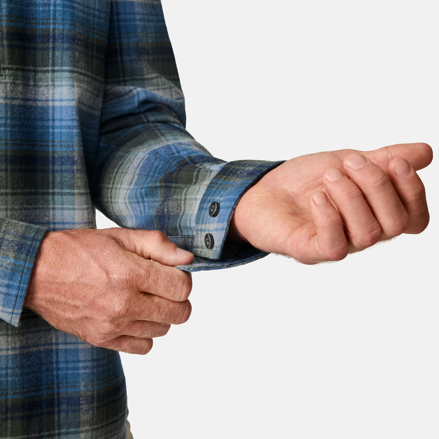 [Kolby is 6'2" wearing size M.] Men’s long-sleeve plaid button-up shirt in blue, black, and white — soft flannel texture with checkered design and casual fit