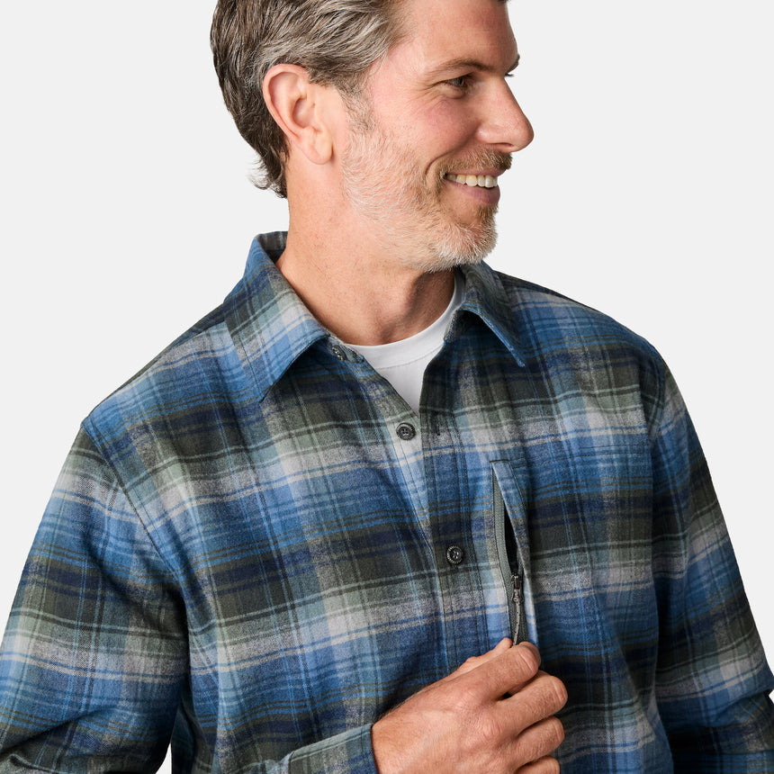 [Kolby is 6'2" wearing size M.] Men’s long-sleeve plaid button-up shirt in blue, black, and white — soft flannel texture with checkered design and casual fit