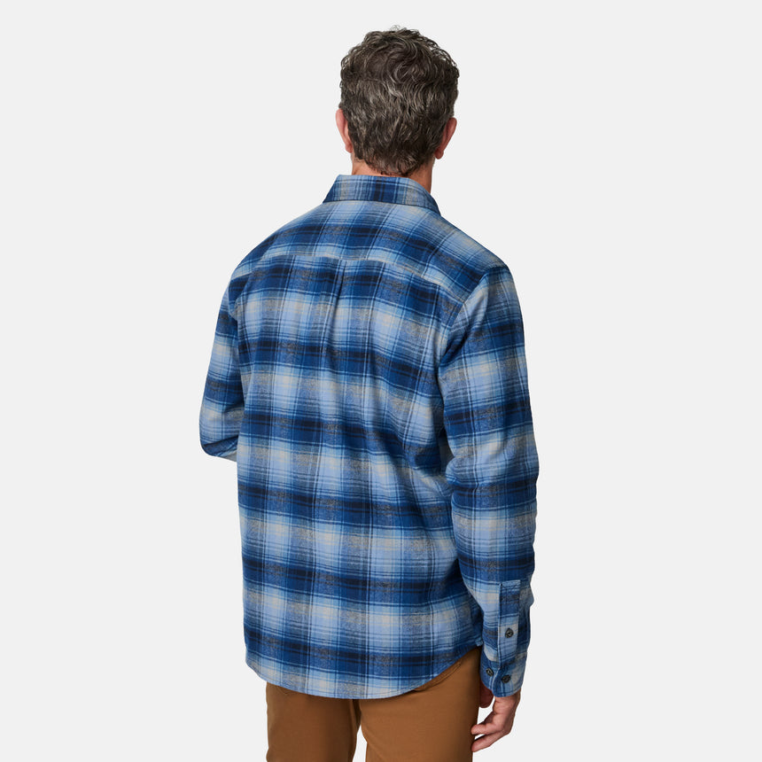 [Kolby is 6'2" wearing size M.] Men’s blue and white plaid button-up shirt with long sleeves, chest pocket, and collar — styled with brown pants for a classic casual look