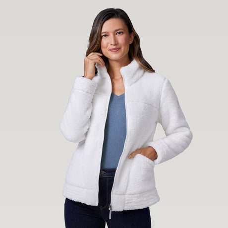 [Model is wearing a size Small.] Woman wearing a Free Country white winter jacket standing against a plain light gray background.