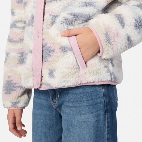 Close-up of a child wearing a fuzzy sherpa jacket with a pastel tie-dye pattern in pink, lavender, and cream, paired with blue jeans.