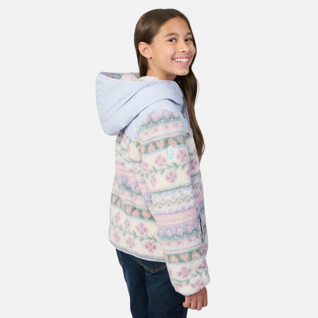 A girl wearing a light blue hooded jacket with a pastel multicolor Fair Isle pattern, shown from the side against a plain light gray background.
