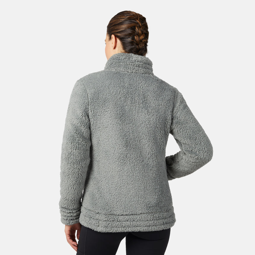 Person wearing a gray/green fleece jacket on a white background