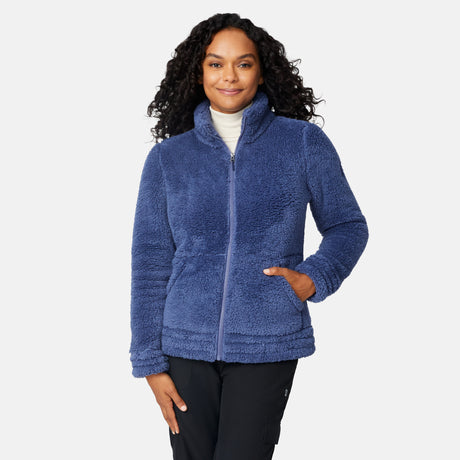 Woman wearing a blue fleece jacket on a white background
