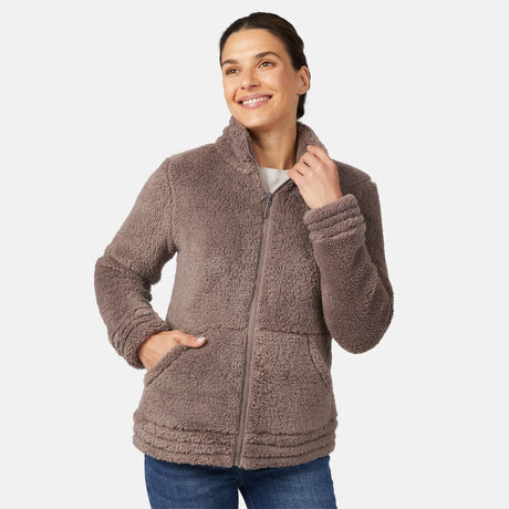 Woman wearing a brown sherpa jacket on a white background