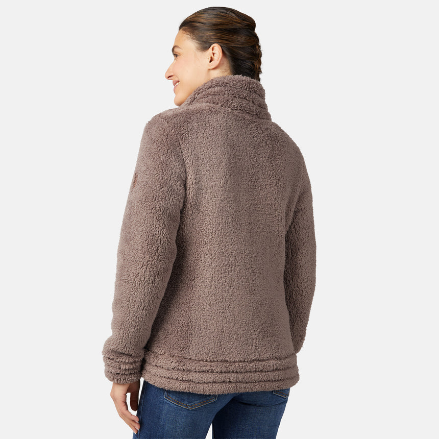 Woman wearing a brown sherpa jacket on a white background